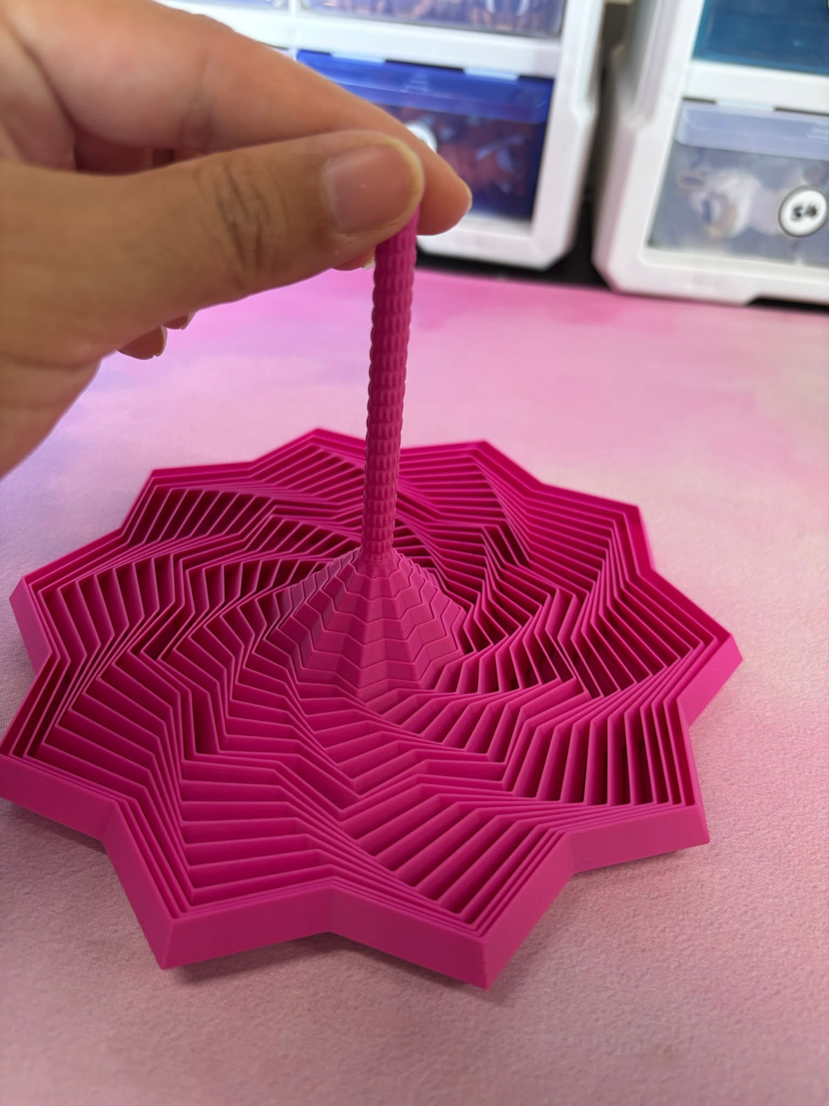 Expanded Sensory Fidget Star, pink, close-up of star base and center pull