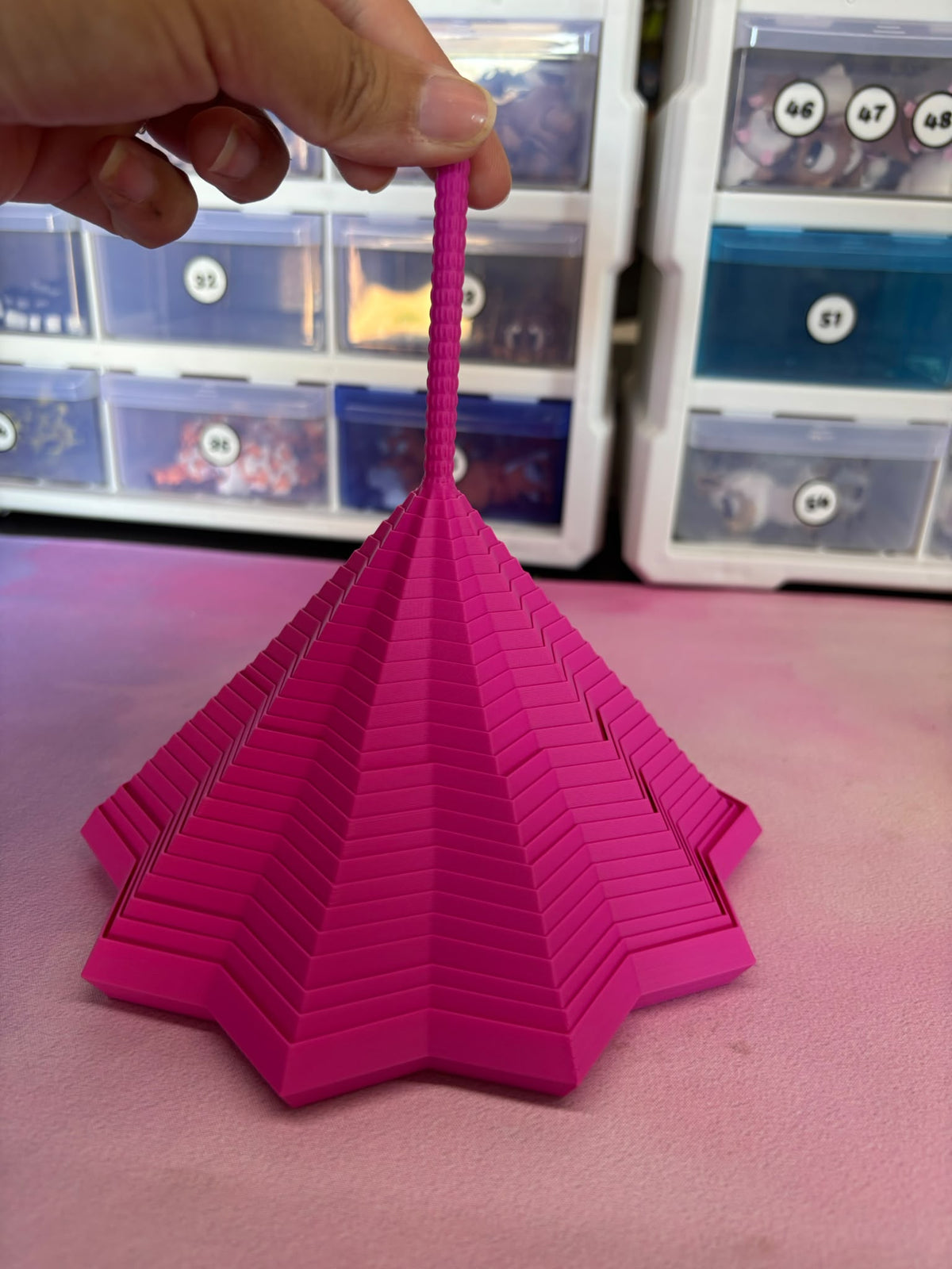 Expanded Sensory Fidget Star, pink, pulled up into tall cone shape